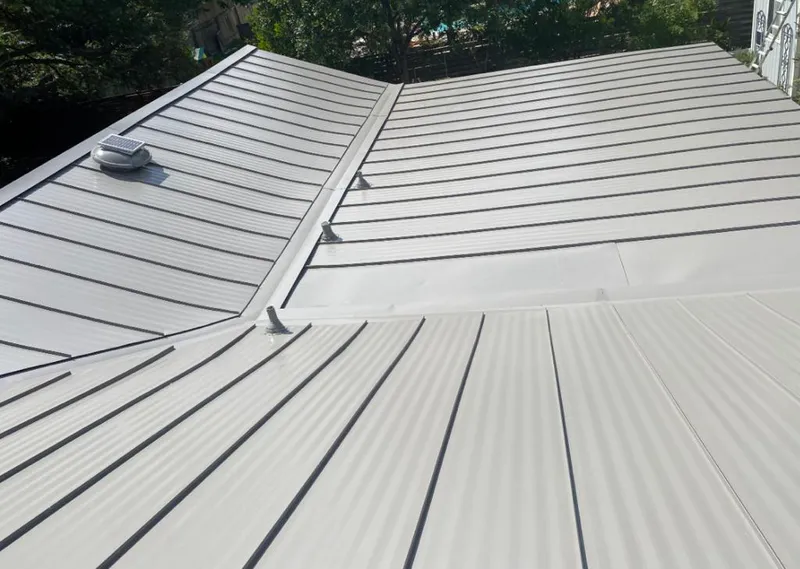 Solar attic fan installed on a metal roof for Roof Ventilation in Chesapeake